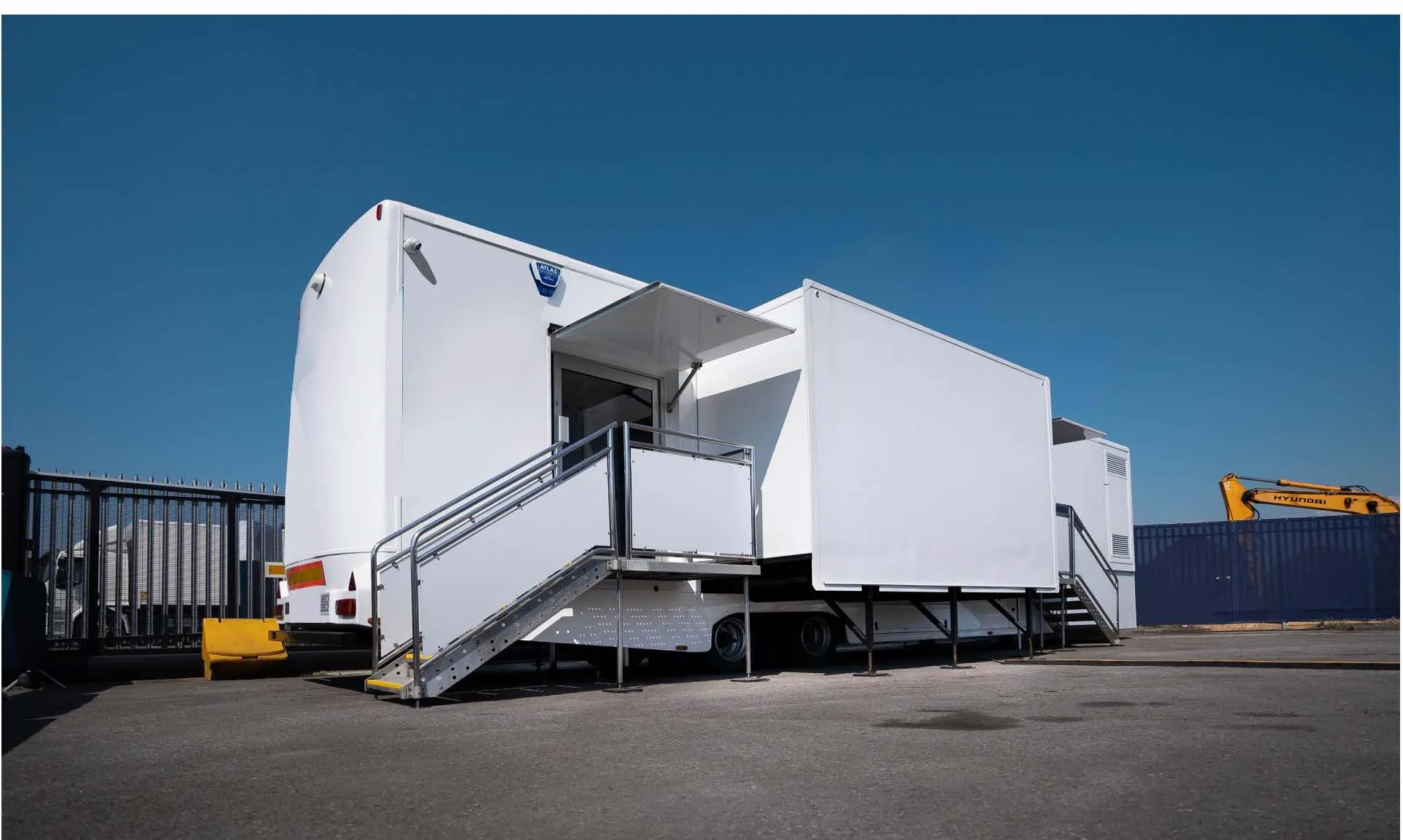 Mobile laboratory deployed with side pod extended and access steps